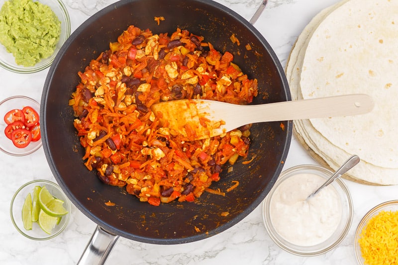 Preparing chicken burritos
